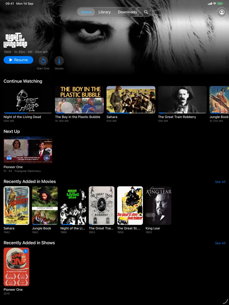 Home on iPad with the featured film, Continue Watching, Next Up and Recently Added